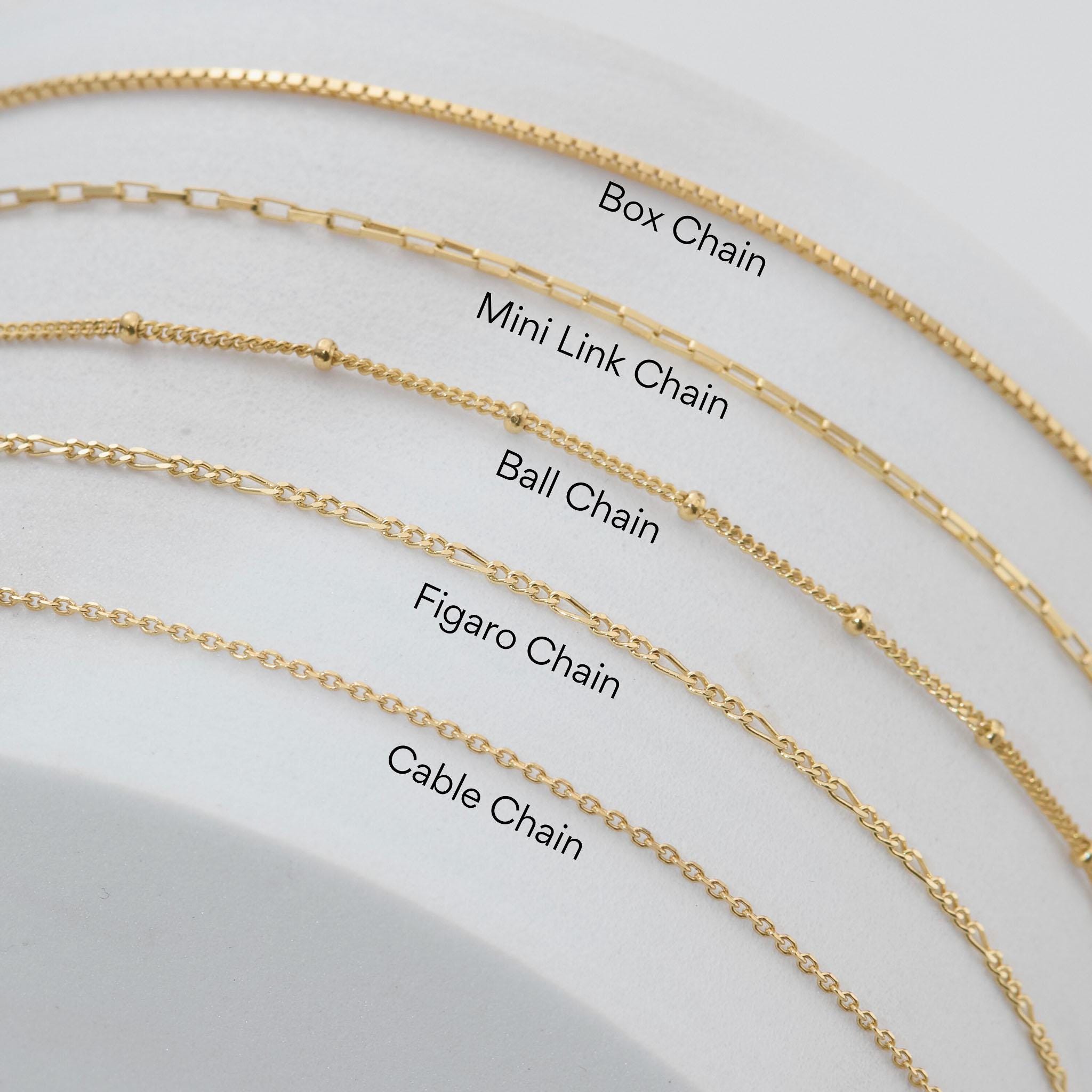 a close up of a number of different types of necklaces