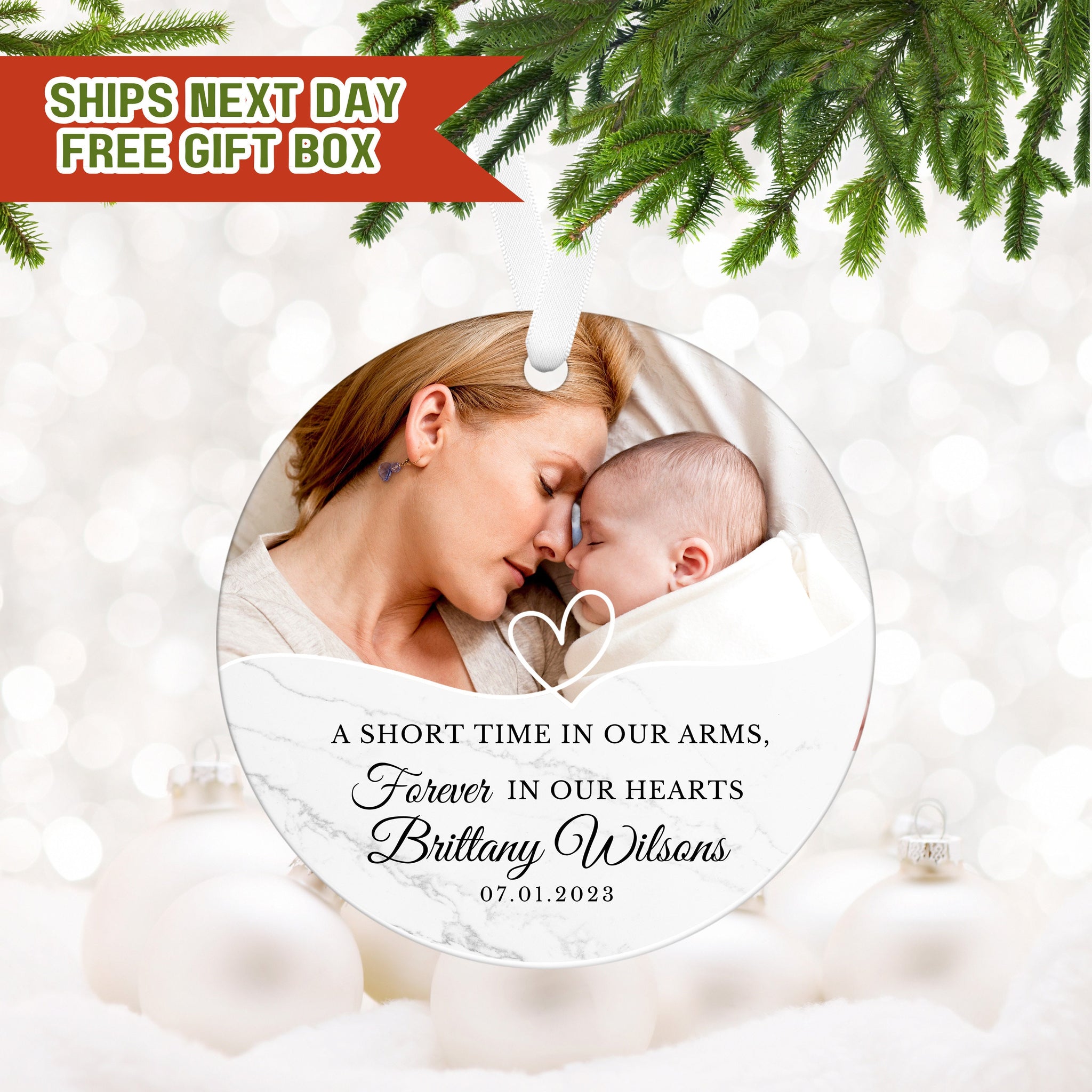a christmas ornament with a picture of a woman holding a baby
