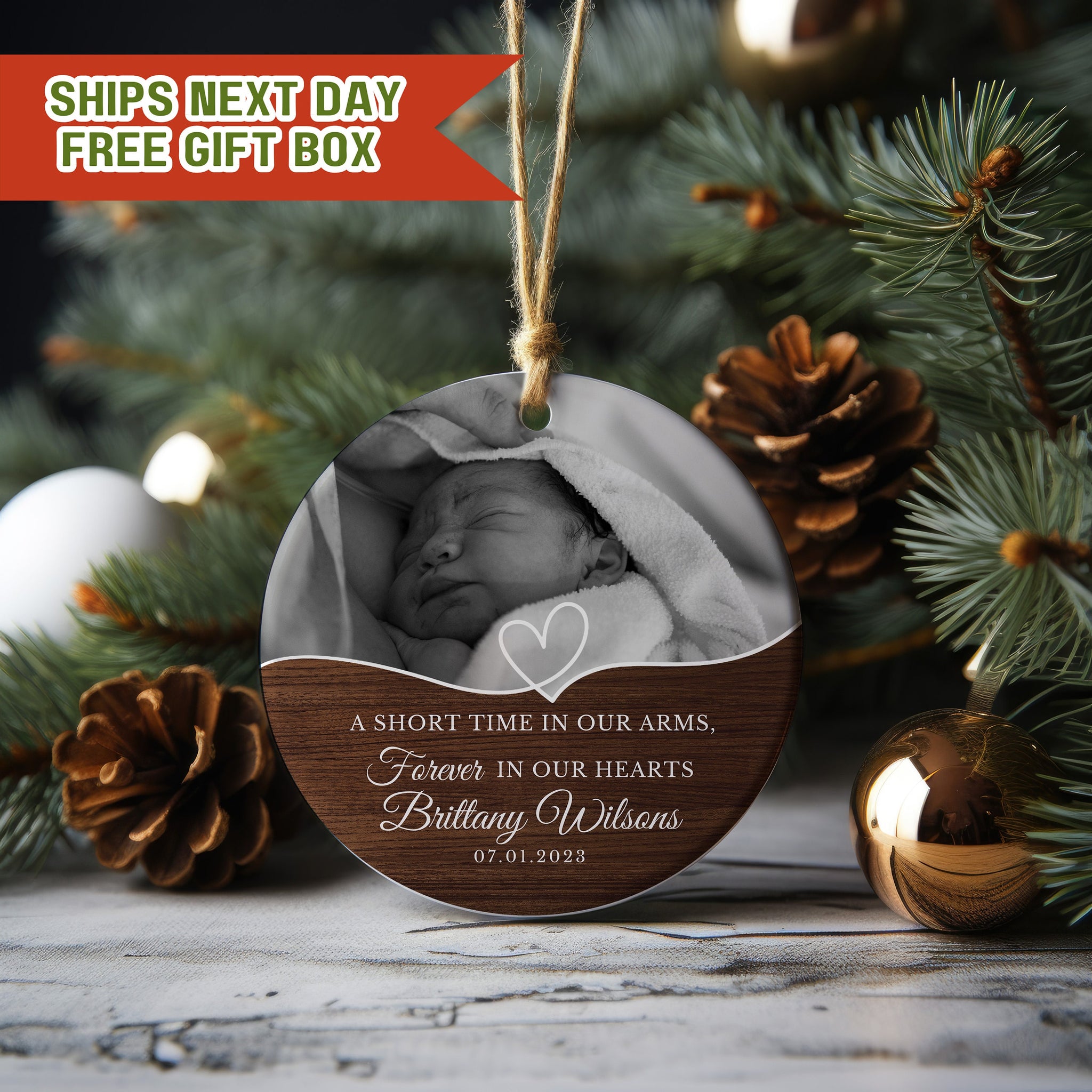 a christmas ornament with a picture of a baby in a blanket