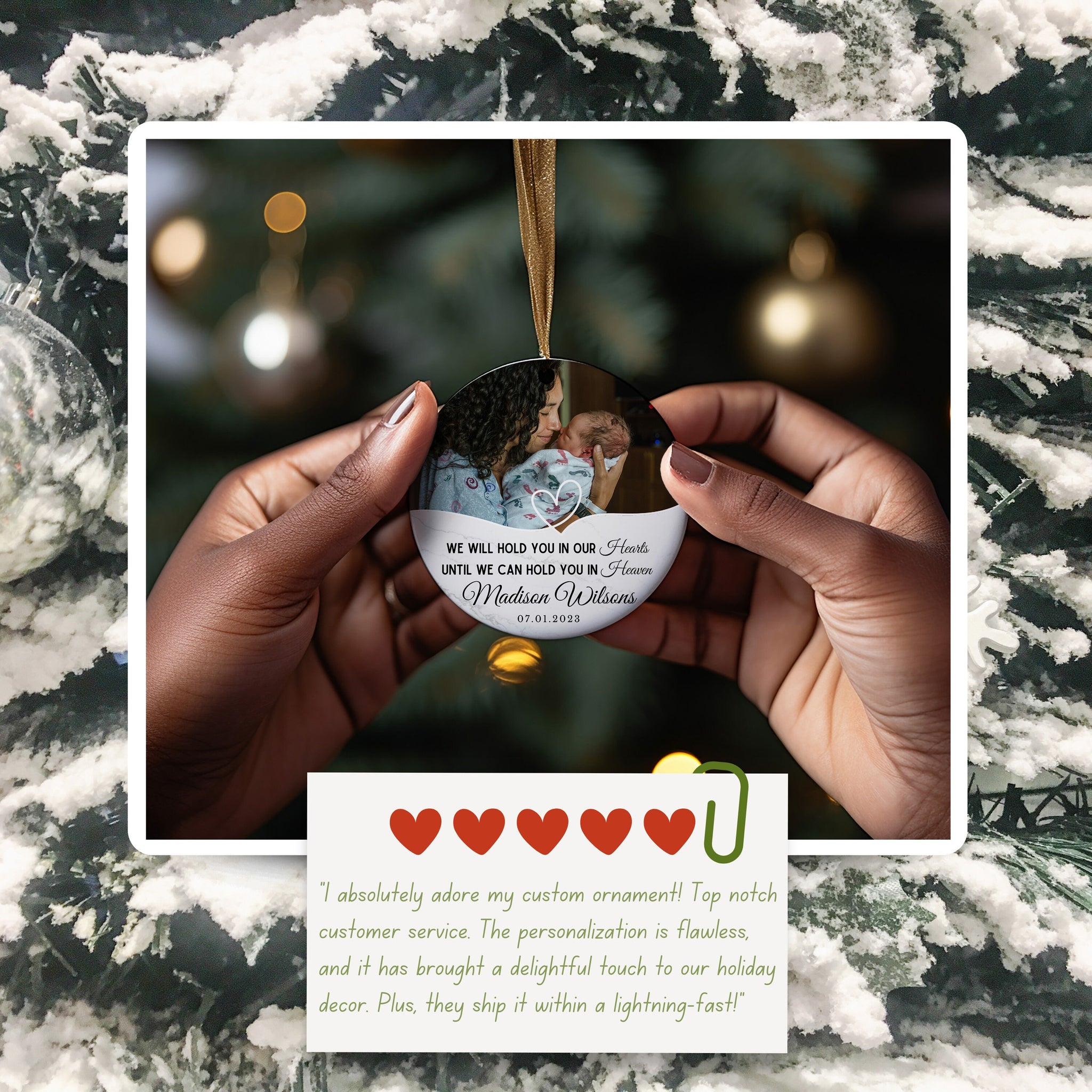 a hand holding a christmas ornament with a picture of a couple