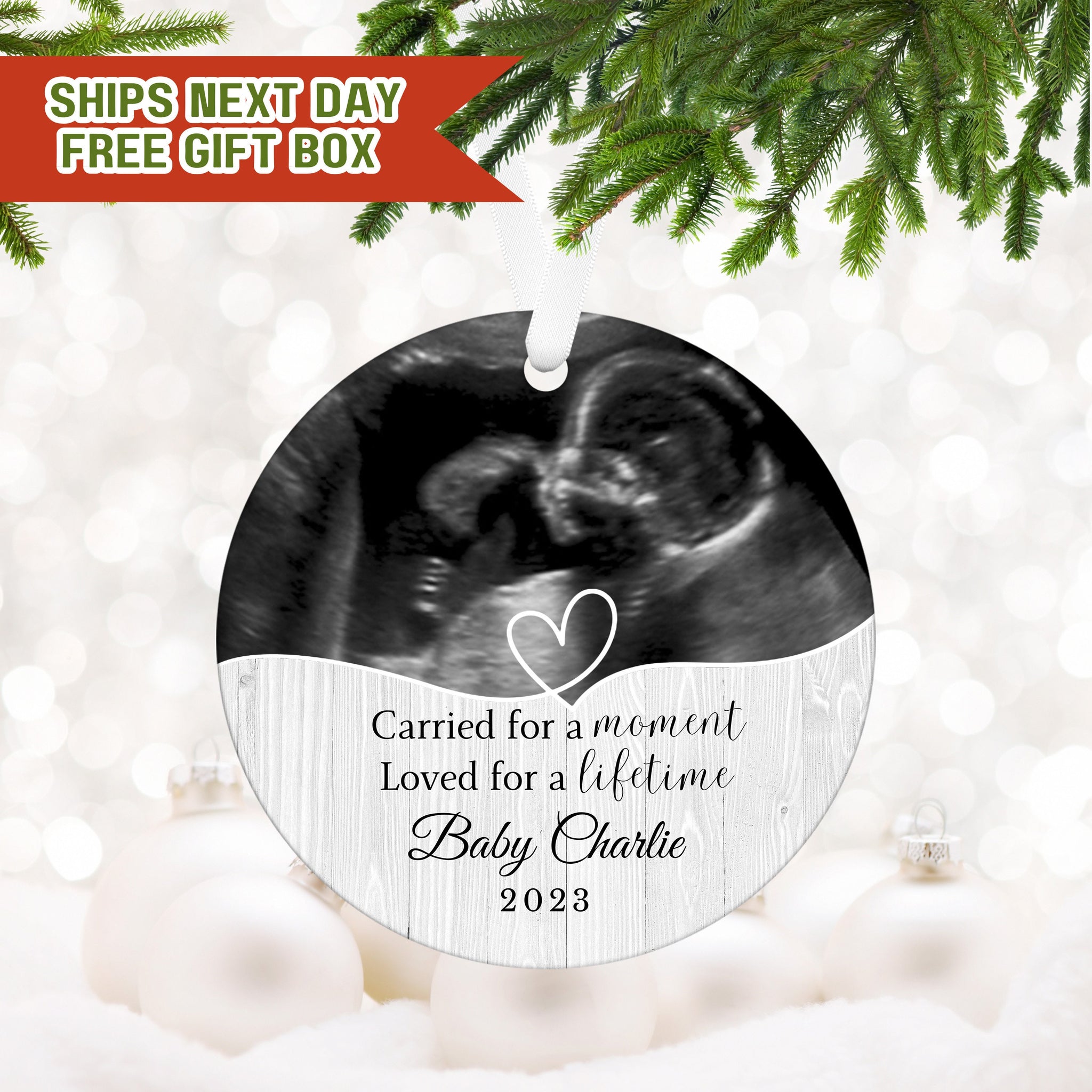 a christmas ornament with a picture of a baby in a crib